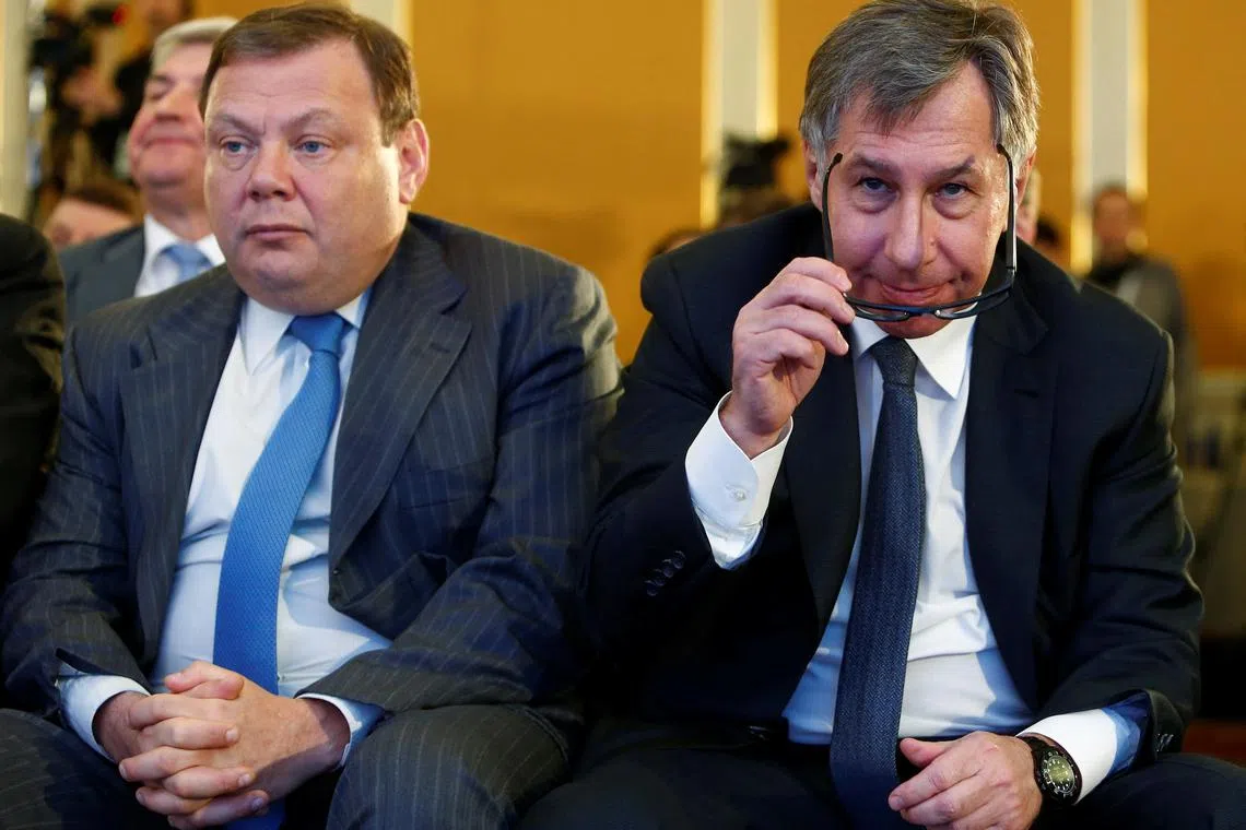 FILE PHOTO: Businessmen Petr Aven (R) and Mikhail Fridman attend a session during the Week of Russian Business, organized by the Russian Union of Industrialists and Entrepreneurs (RSPP), in Moscow, Russia March 16, 2017. REUTERS/Sergei Karpukhin/File Photo