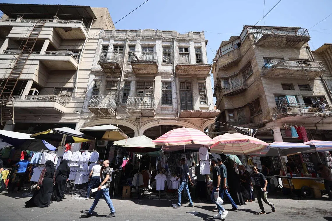 People shopping at a market in Al-Rashid Street in Baghdad on Sept 10.