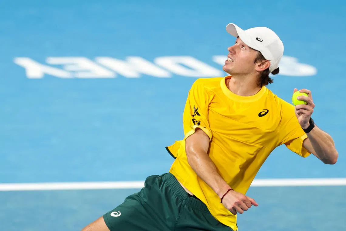 Team Australia's Alex de Minaur throwing a signed ball into the crowd after winning his group stage men's singles match against Tomas Martin Etcheverry of Argentina.