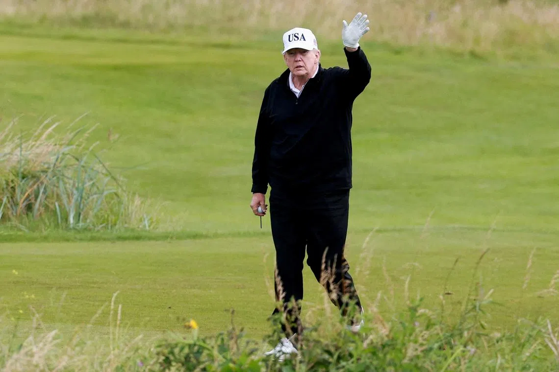 FILE PHOTO: U.S. President Donald Trump waves on the golf course at Trump Turnberry resort in Turnberry, Scotland, Britain, July 26, 2025. REUTERS/Phil Noble/File Photo