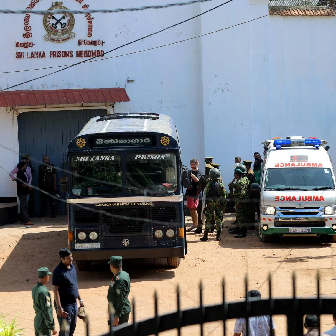 Prisoners boarding a bus to be transferred to another prison following clashes between two groups of inmates at Negombo Prison, in the coastal town of Negombo, Sri Lanka, on July 6.