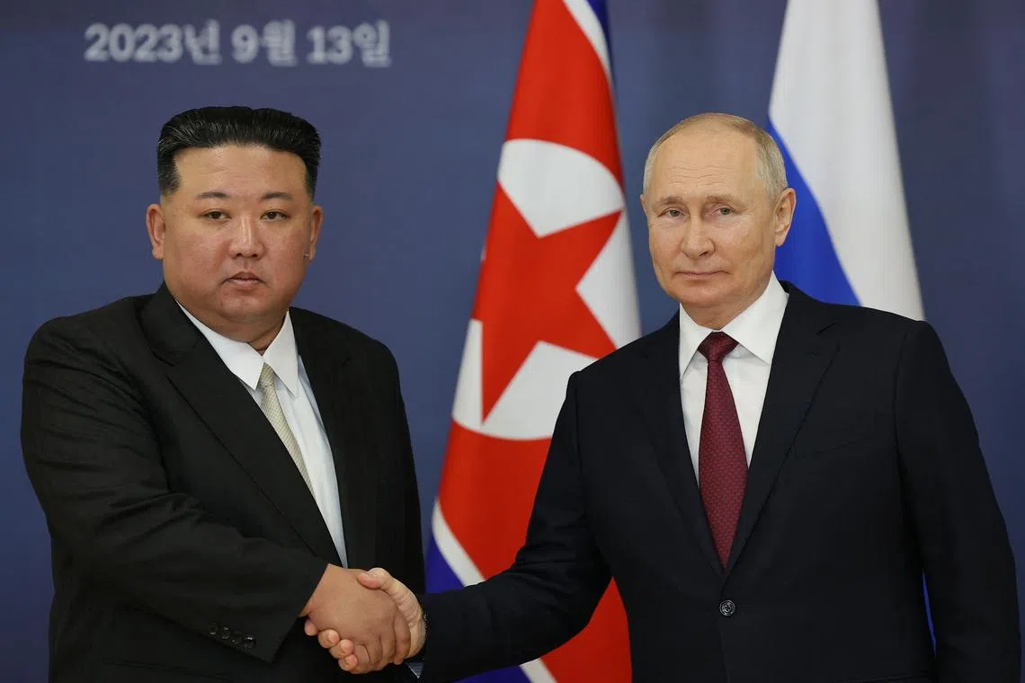 Russian President Vladimir Putin (right) and North Korea's leader Kim Jong Un shaking hands at the Vostochny Cosmodrome in Amur region on Sept 13, 2023.