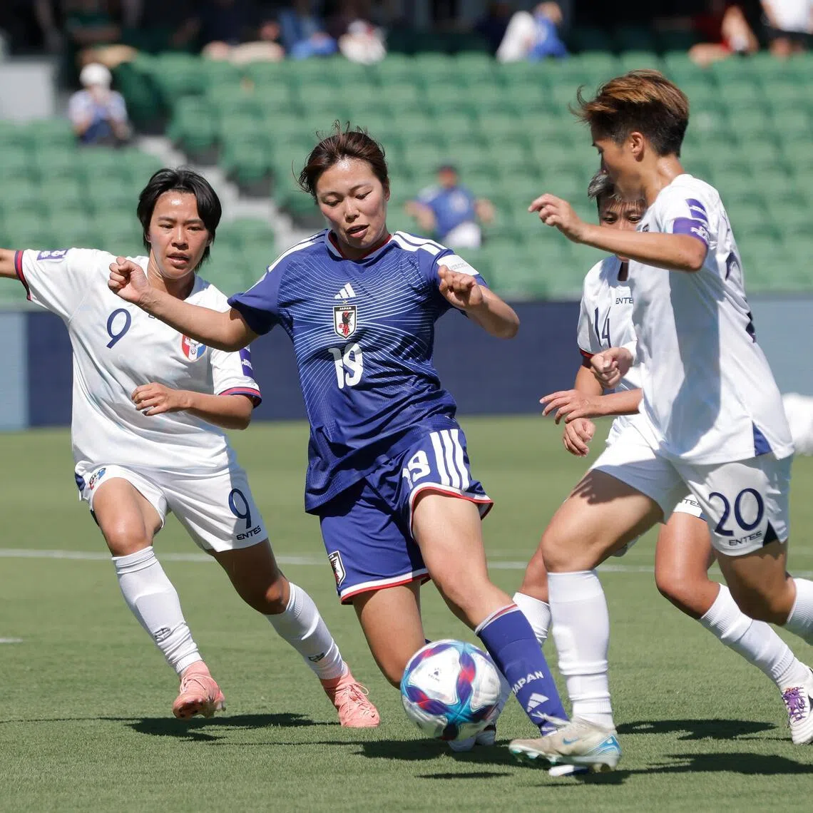 Japan's Momoko Tanikawa (in blue) in action during their 2-0 Women’s Asian Cup win in Perth on March 4.
