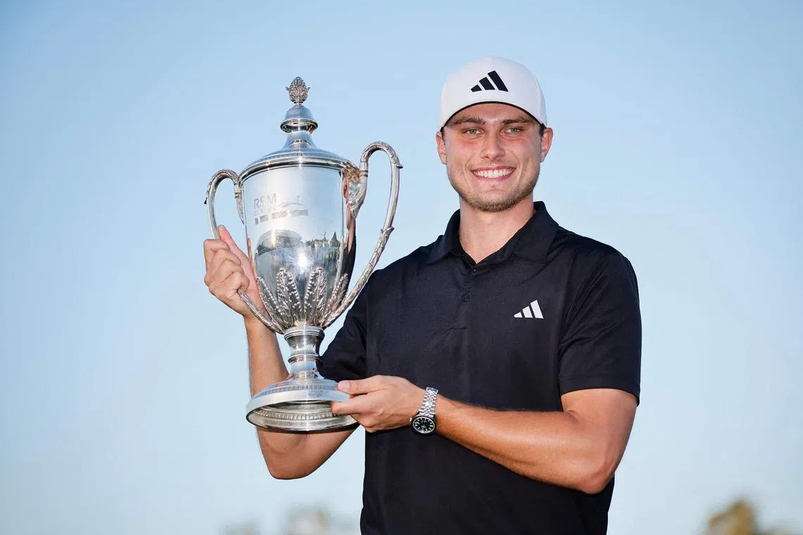 Ludvig Aberg of Sweden posing for a photo with the trophy after winning The RSM Classic at the Sea Island Resort in Georgia, United States.