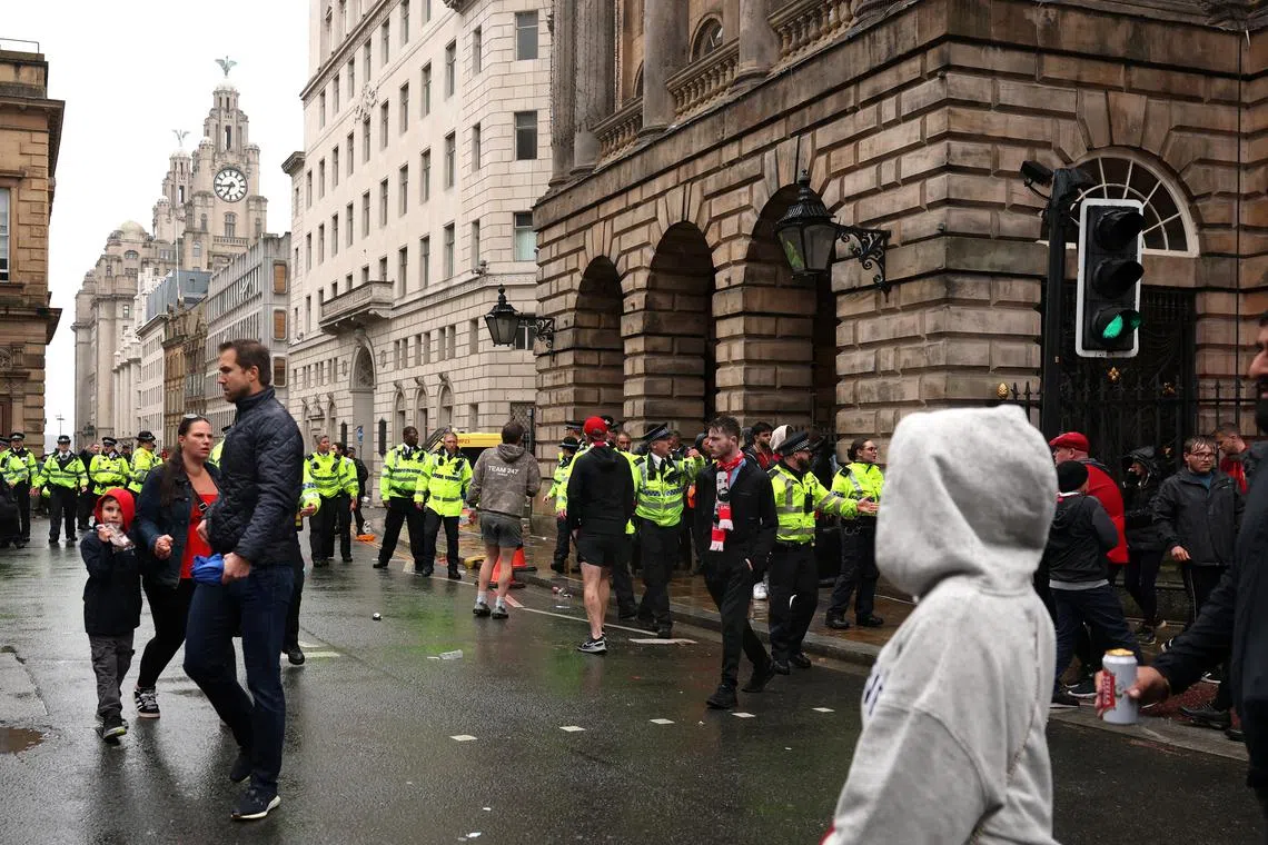 British man detained after car hits fans at Liverpool parade
