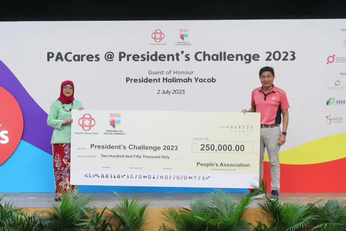 President Halimah Yacob received a cheque from PA at the Hong Kah North Community Centre on July 2.
