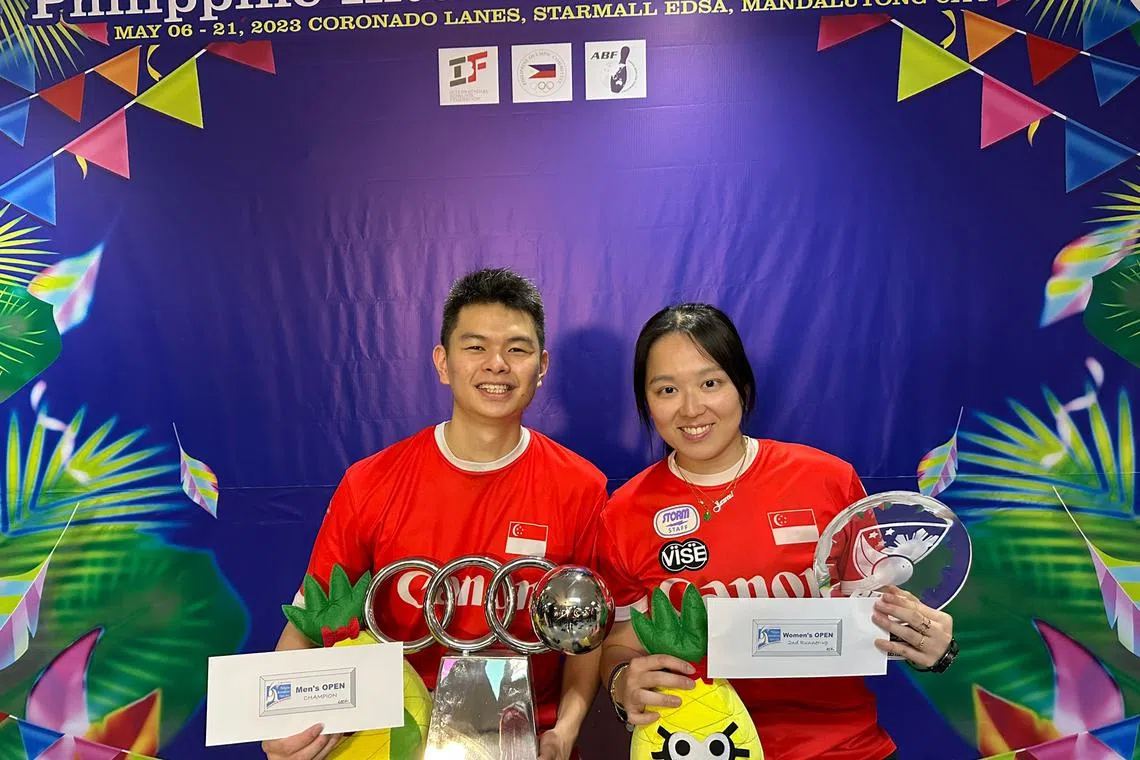 National bowler Darren Ong (left) and Jazreel Tan posing with their trophies at the Philippine Bowling Federation (PBF) 4th Philippine International Open.