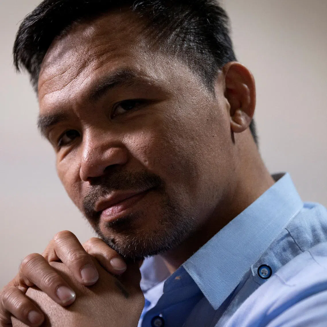 FILE PHOTO: Presidential candidate and former boxing champion Manny Pacquiao poses for a photograph during an interview with Reuters at his campaign headquarters in Makati City, Philippines, April 7, 2022. Picture taken April 7, 2022. REUTERS/Eloisa Lopez/File Photo