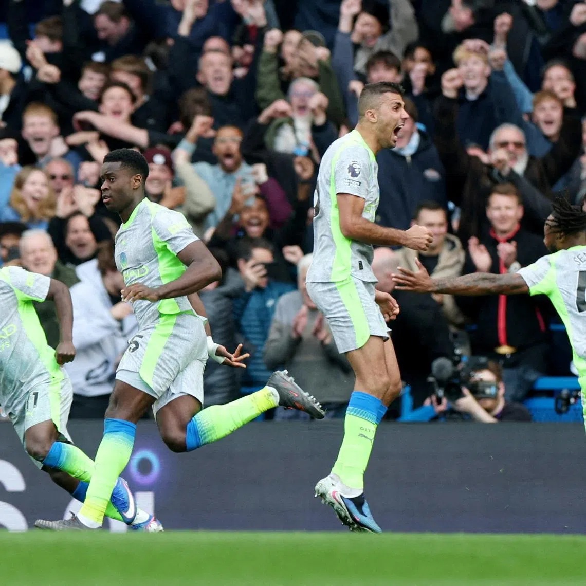 Soccer Football - Premier League - Chelsea v Manchester City - Stamford Bridge, London, Britain - April 12, 2026 Manchester City's Marc Guehi celebrates scoring their second goal with teammates REUTERS/Isabel Infantes