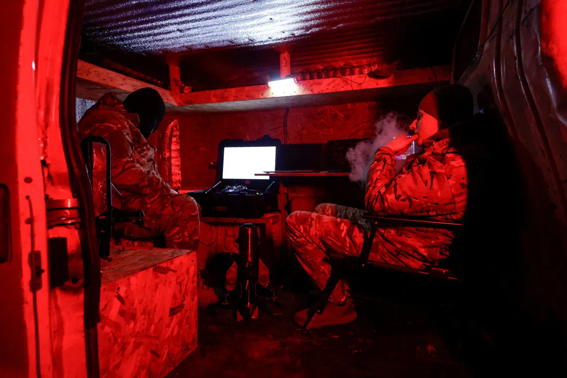 Service members of an air-defence unit of the 115th Separate Mechanized Brigade wait inside a van during their combat shift near the frontline town of Kupiansk, amid Russia's attack on Ukraine, in Kharkiv region, Ukraine November 14, 2025.  REUTERS/Sofiia Gatilova