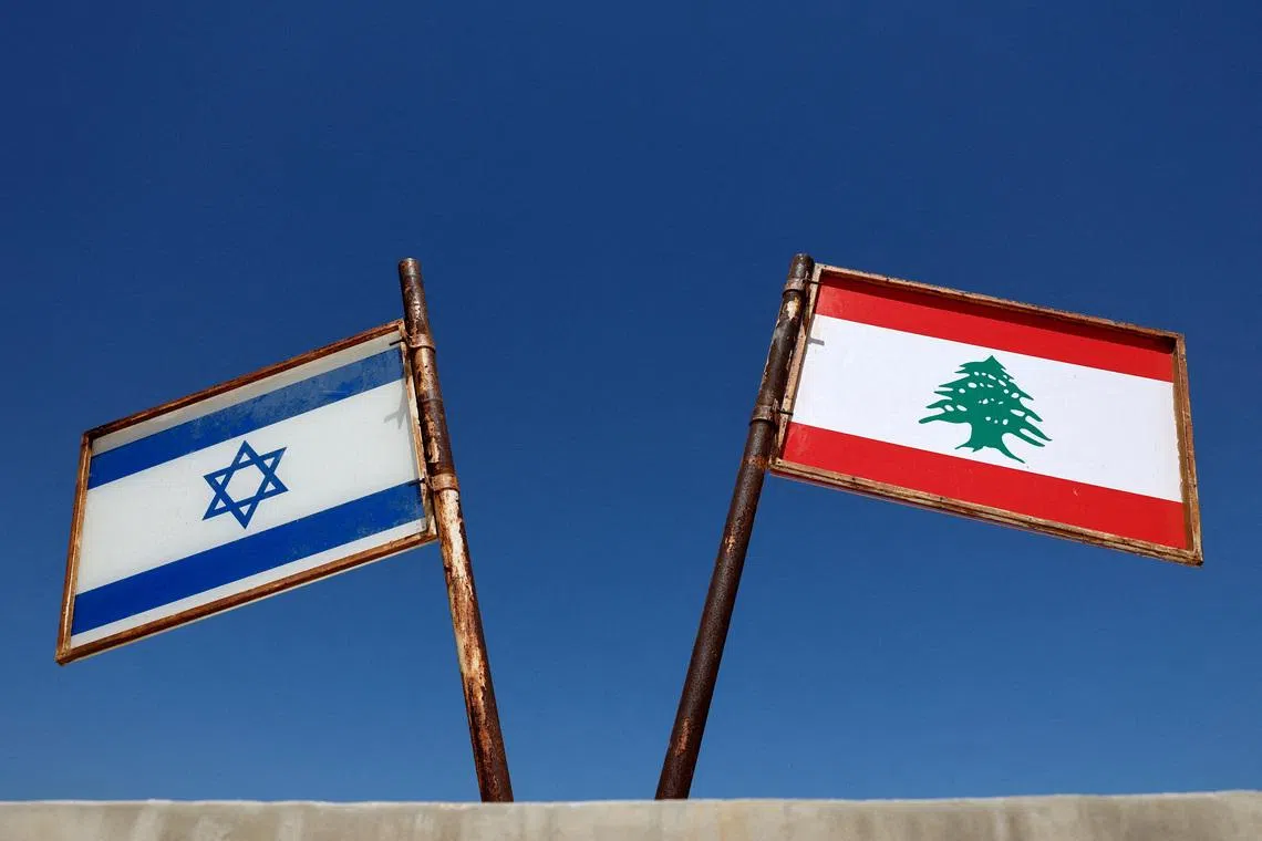 FILE PHOTO: Representations of the Israeli and Lebanese flags at a memorial near the Israel-Lebanon border, outside Metula, Israel, June 27, 2026, after Israel and Lebanon signed a framework agreement following U.S.-mediated talks. REUTERS/Amir Cohen/File Photo