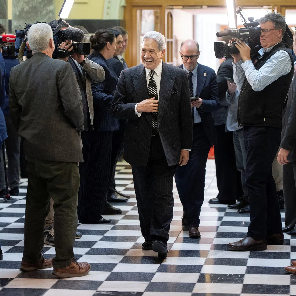New Zealand First leader Winston Peters reacts as he walks past members of the media at Parliament House in Wellington, New Zealand, September 22, 2026. REUTERS/Marty Melville