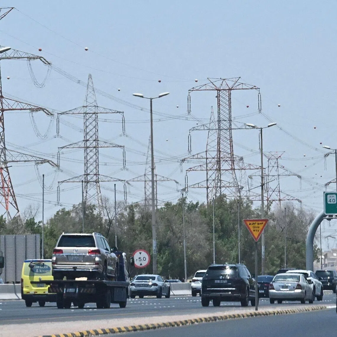 Vehicles drive along a highway on the outskirts of Kuwait City on July 8.