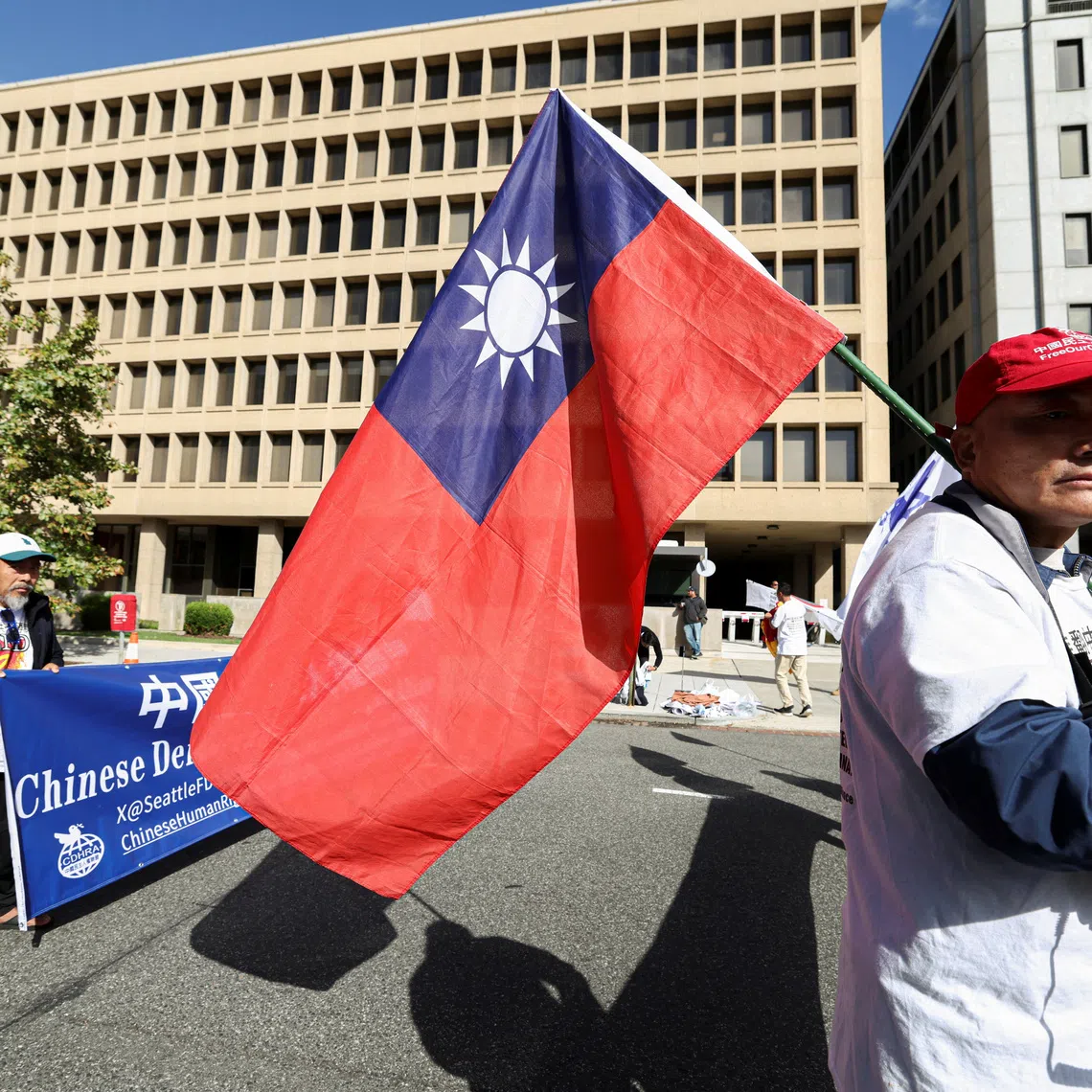 A demonstrator holding a Taiwanese flag during a protest near the White House on Sept 24, the day of a meeting between Chinese President Xi Jinping and US President Donald Trump.