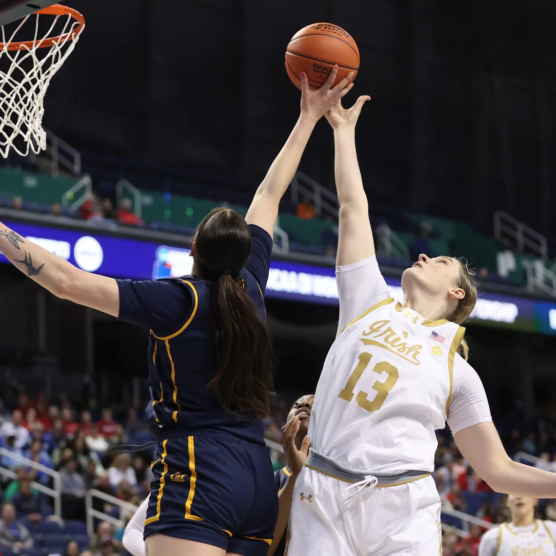 FILE PHOTO: Mar 7, 2025; Greensboro, NC, USA;  Notre Dame Fighting Irish forward Kate Koval (13) shoots the ball and is blocked during the fourth quarter by California Golden Bears forward Marta Suarez (7) at First Horizon Coliseum. Mandatory Credit: Cory Knowlton-Imagn Images/File Photo