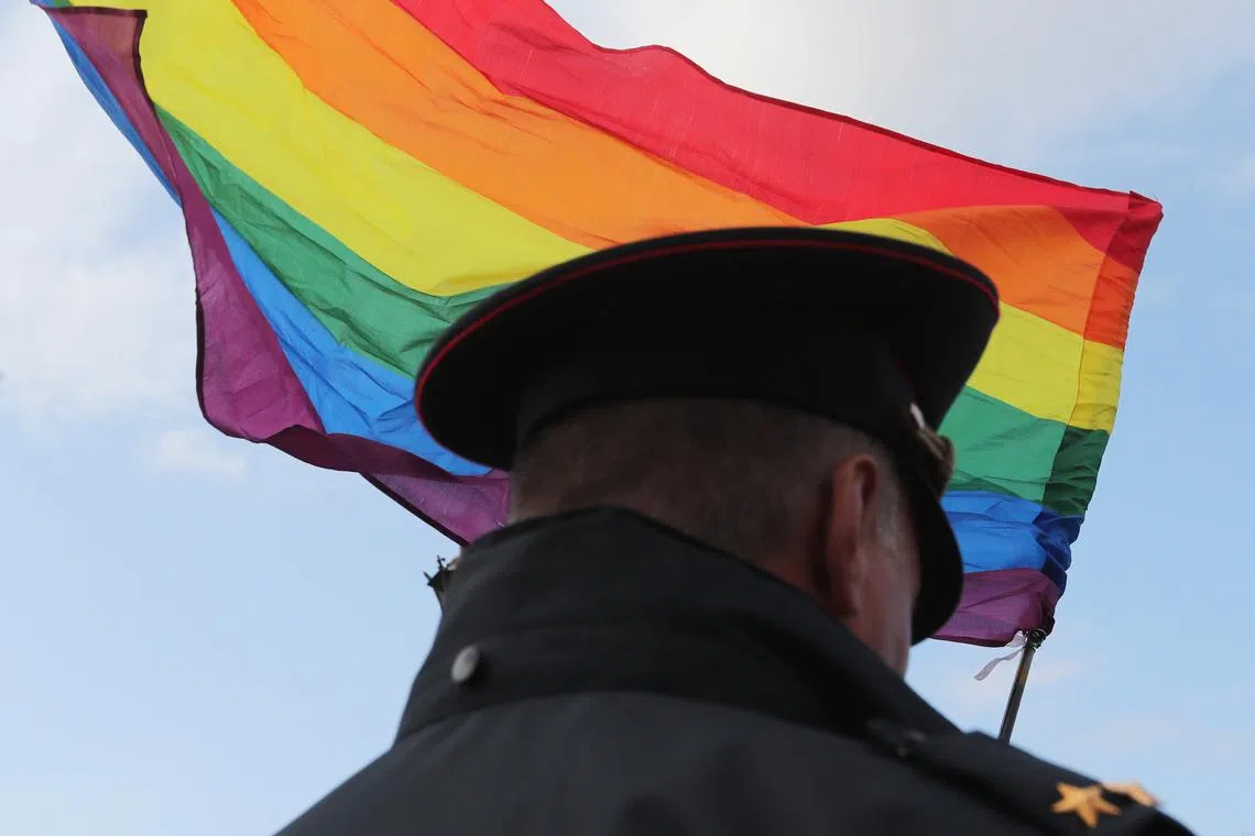 A law enforcement officer stands guard during the LGBT community rally \"X St.Petersburg Pride\" in central Saint Petersburg, Russia August 3, 2019. REUTERS/Anton Vaganov/File Photo