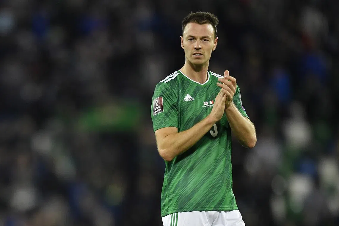 FILE PHOTO: Soccer Football - World Cup - UEFA Qualifiers - Group C - Northern Ireland v Italy - Windsor Park, Belfast, Northern Ireland - November 15, 2021 Northern Ireland's Jonny Evans celebrates after the match REUTERS/Clodagh Kilcoyne/File Photo