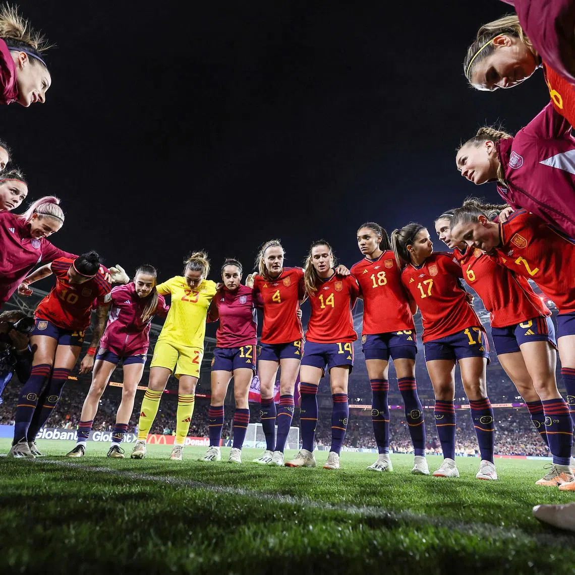 Spain's players standing in a huddle ahead of the Women's World Cup final win over England on Aug 20 at Stadium Australia in Sydney.