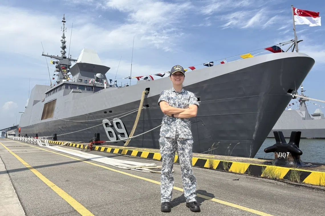 saf scholar major jina lim in front of singapore navy rss intrepid, first major overseas mission
