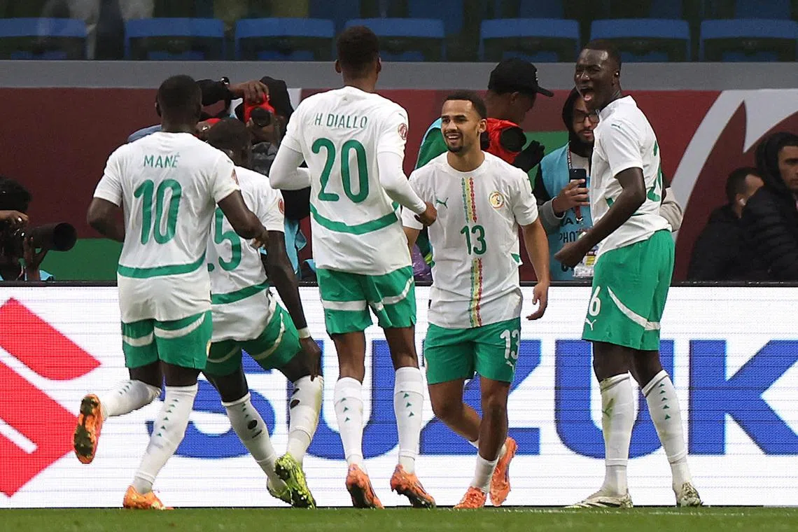 Soccer Football - CAF Africa Cup of Nations - Morocco 2025 - Quarter Final - Mali v Senegal - Tangier Grand Stadium, Tangier, Morocco - January 9, 2026 Senegal's Iliman Ndiaye celebrates scoring their first goal with teammates REUTERS/Amr Abdallah Dalsh