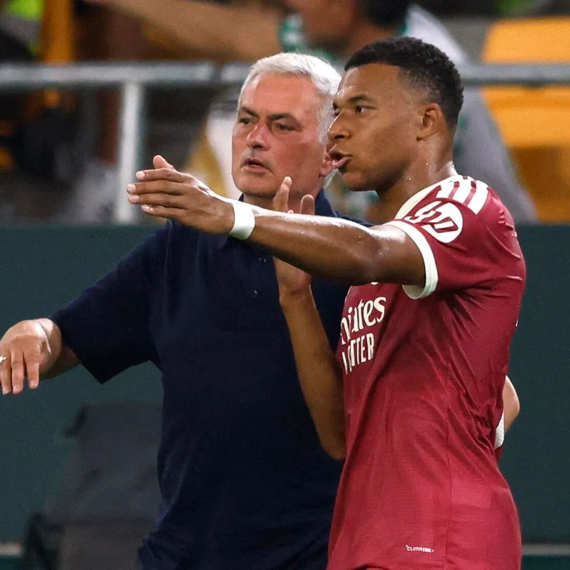Real Madrid coach Jose Mourinho gives instructions to star forward Kylian Mbappe during their La Liga loss to Real Betis on Sept 4.