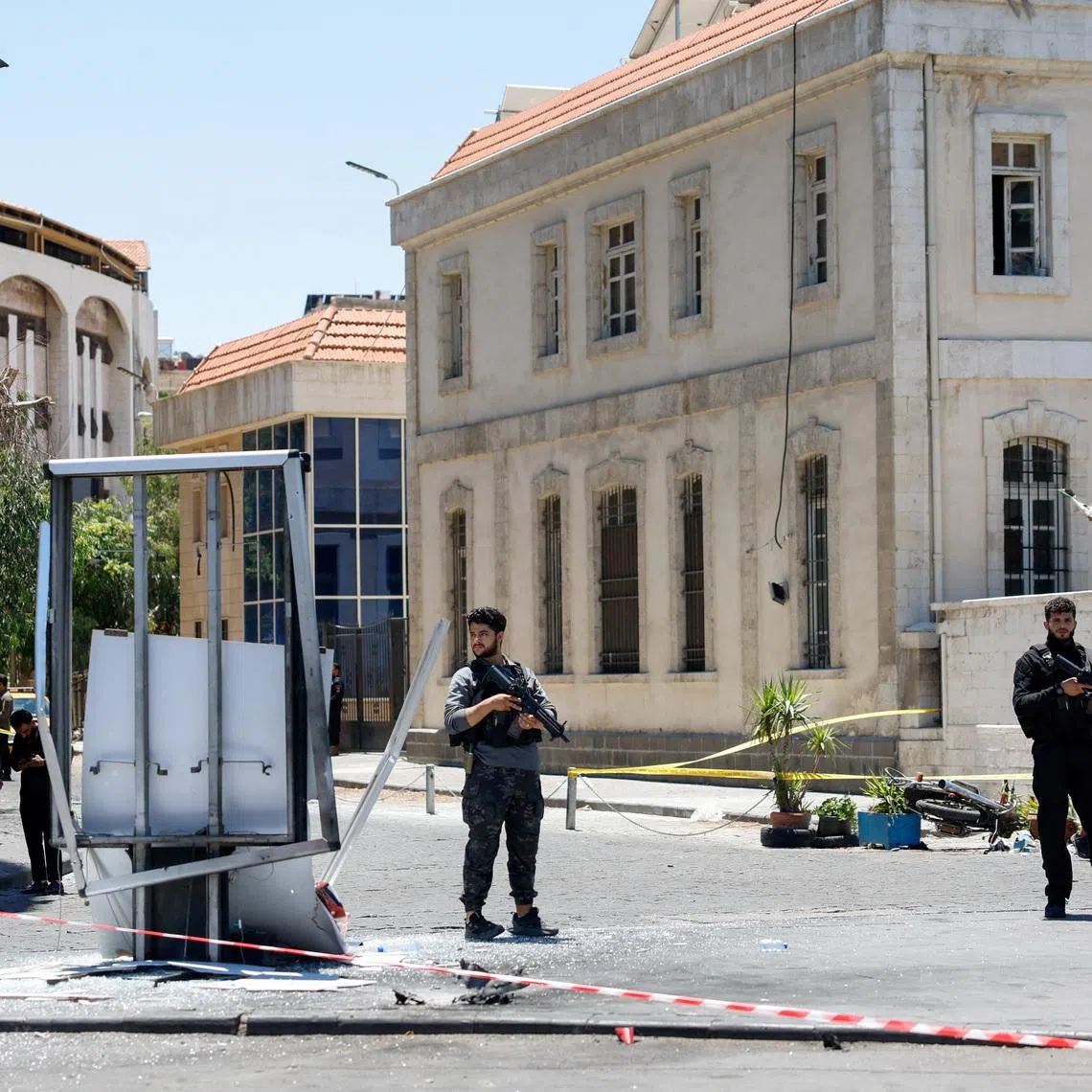 A cordoned-off area and a damaged structure in the aftermath of explosions near a hotel where French President Emmanuel Macron was meant to be staying, in Damascus, Syria, July 7, 2026. REUTERS/Yamam Al Shaar