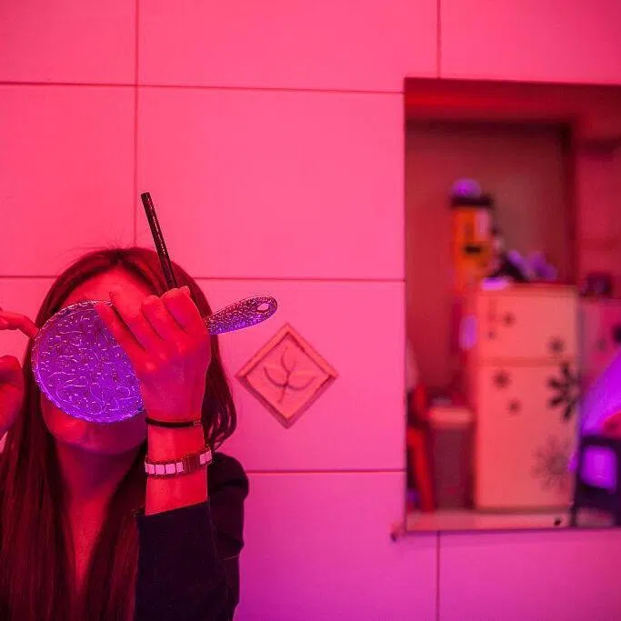 A sex worker applies a makeup in Miari red light district in Seoul, South Korea.