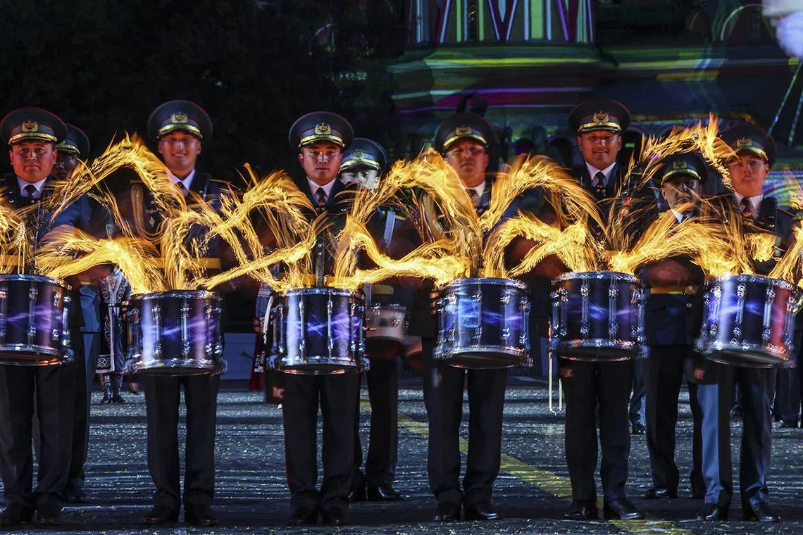epa12314654 Members of the Central Military Band and the Central Ensemble of the National Military and Patriotic Center of the Kazakhstan Armed Forces perform during the opening of the International Military Music Festival 'Spasskaya Tower' on the Red Square in Moscow, Russia, 21 August 2025. The festival runs from 21 to 31 August 2025. EPA/YURI KOCHETKOV