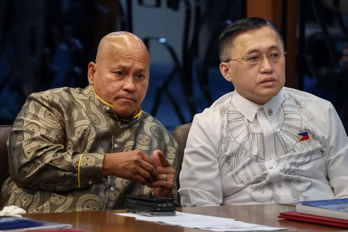 Philippine senators Ronald dela Rosa (left) and Bong Go attending a session at the Senate, which holds dela Rosa under protective custody amid an International Criminal Court warrant, in Pasay City on May 13.