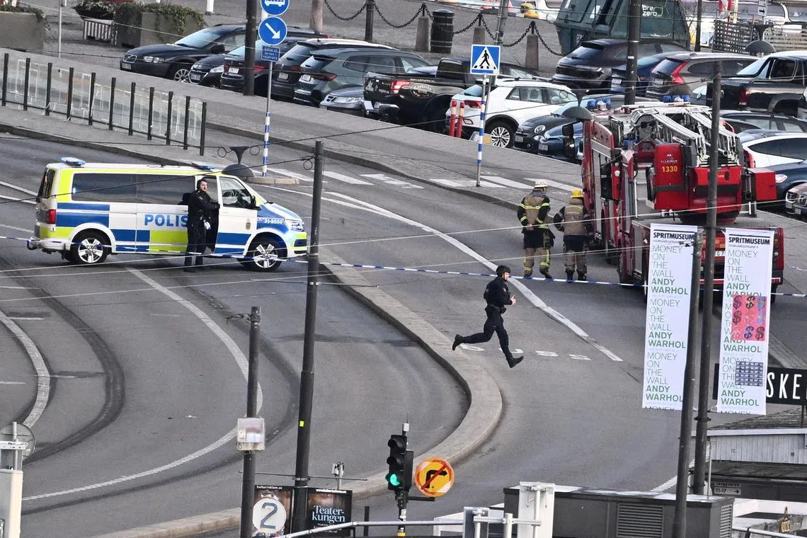 FILE PHOTO: Police bomb squad on site in the Old Town of Stockholm, Sweden, October 30, 2024, after reports of a hand grenade on the Skeppsbron bridge. TT News Agency/Claudio Bresciani/via REUTERS/File Photo