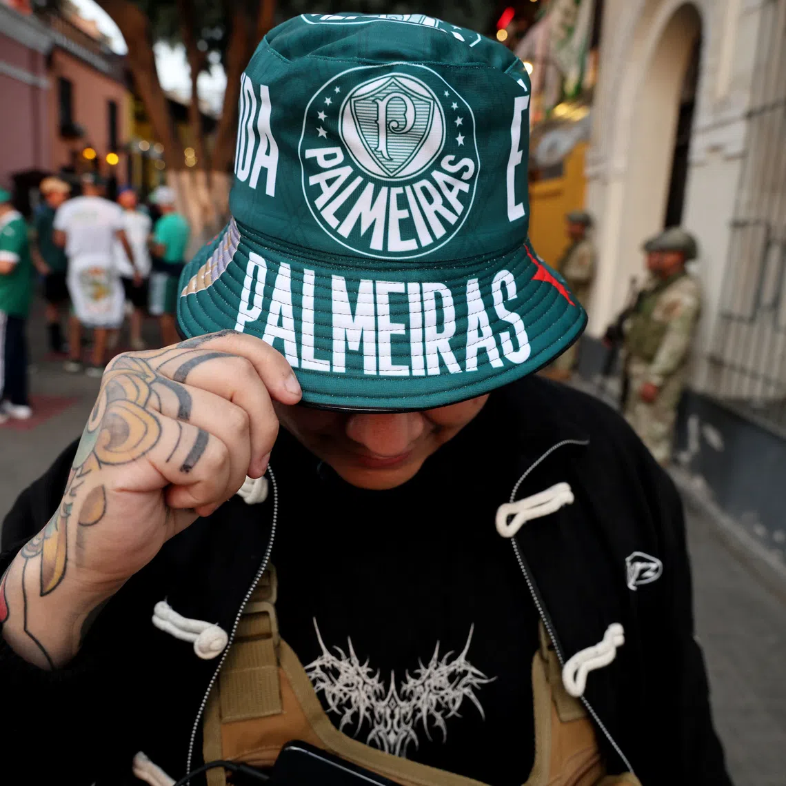 Soccer Football - Copa Libertadores - Final - Fans in the streets of Lima ahead of the final - Lima, Peru - November 27, 2025 Palmeiras fans celebrate in Pasaje Sanchez Carrion ahead of the final REUTERS/Sebastian Castaneda