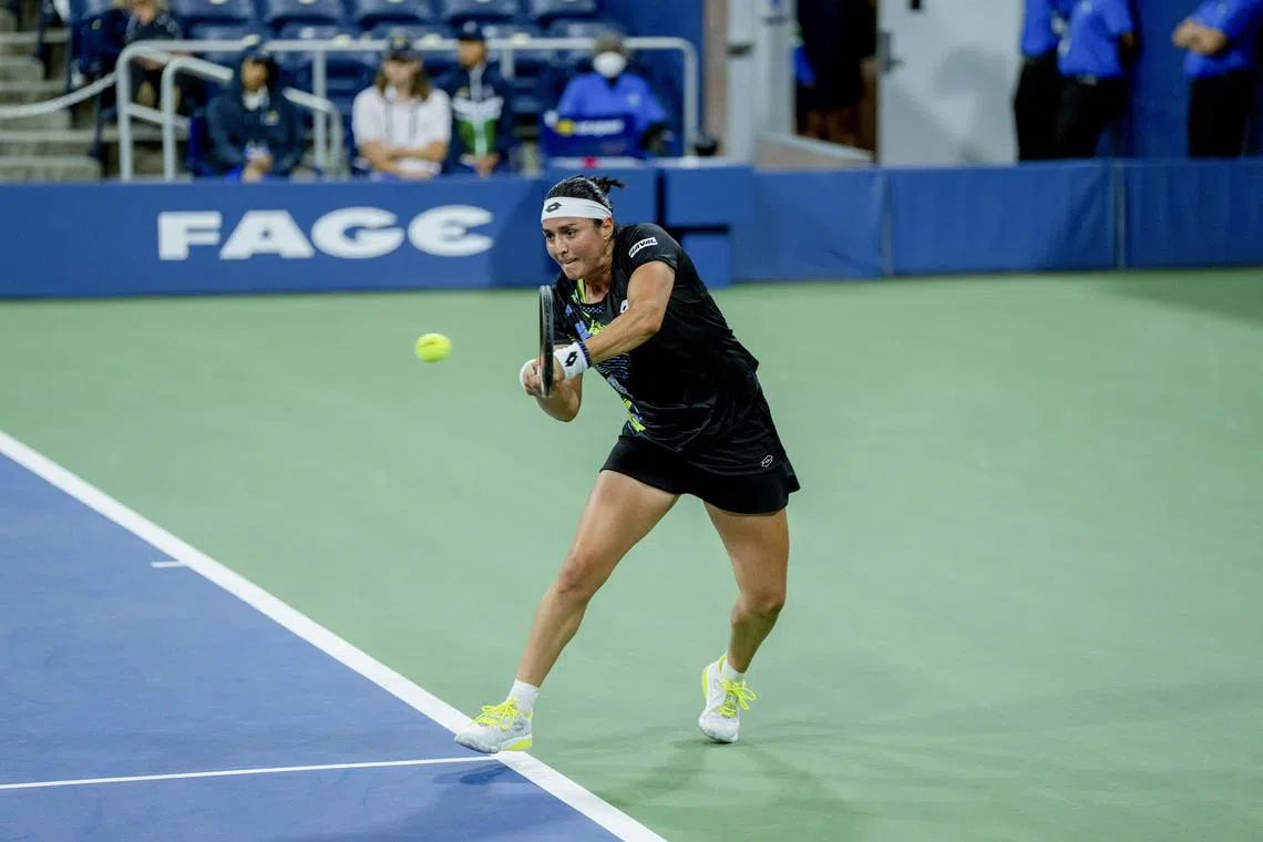 Ons Jabeur of Tunisia returns a shot to Czech Linda Noskova in their US Open second-round clash.