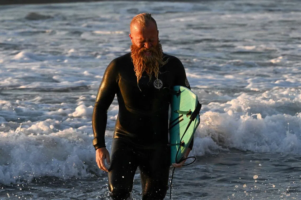 Australian former pro surfer Blake Johnston smashed the world record for the longest continuous surfing session on Friday, saying he felt "pretty cooked" after catching waves for more than 30 exhausting hours. 
