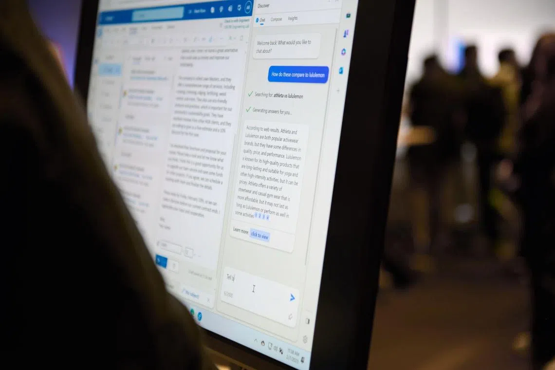 An attendee interacts with the AI-powered Microsoft Bing search engine and Edge browser during an event at the company's headquarters in Redmond, Washington, US, on Tuesday, Feb. 7, 2023. Microsoft unveiled new versions of its Bing internet-search engine and Edge browser powered by the newest technology from ChatGPT maker OpenAI. Photographer: Chona Kasinger/Bloomberg