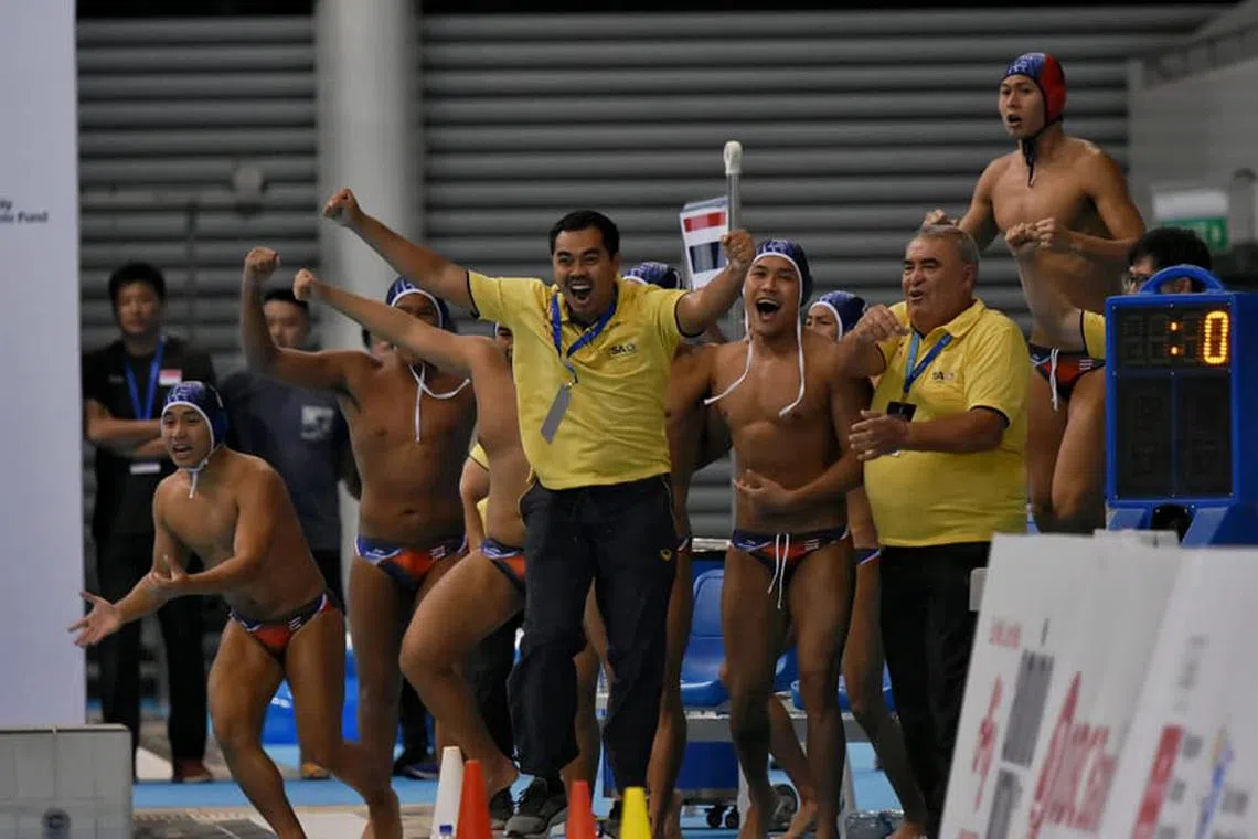 Thailand celebrating their win against Singapore with a 4-2 penalty-shootout victory. Both teams were tied 14-14 in regulation.