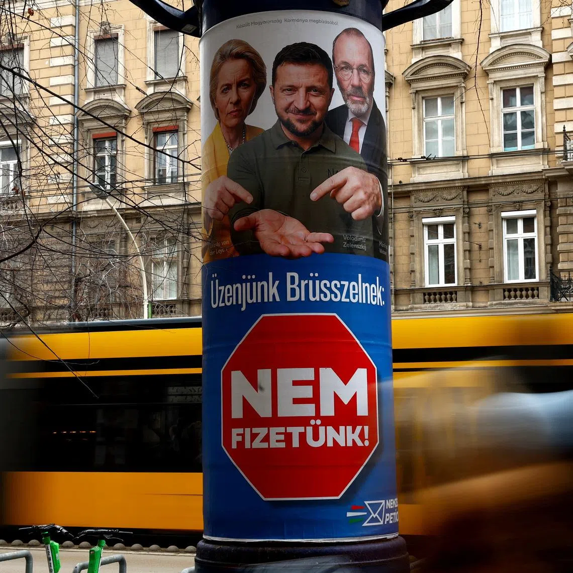 A government election billboard shows European Commission President Ursula von der Leyen, Ukraine's President Volodymyr Zelenskiy and European People's Party (EPP) President Manfred Weber in Budapest, Hungary, February 11, 2026. The billboard reads: \"Our message to Brussels is that we will not pay\". REUTERS/Bernadett Szabo