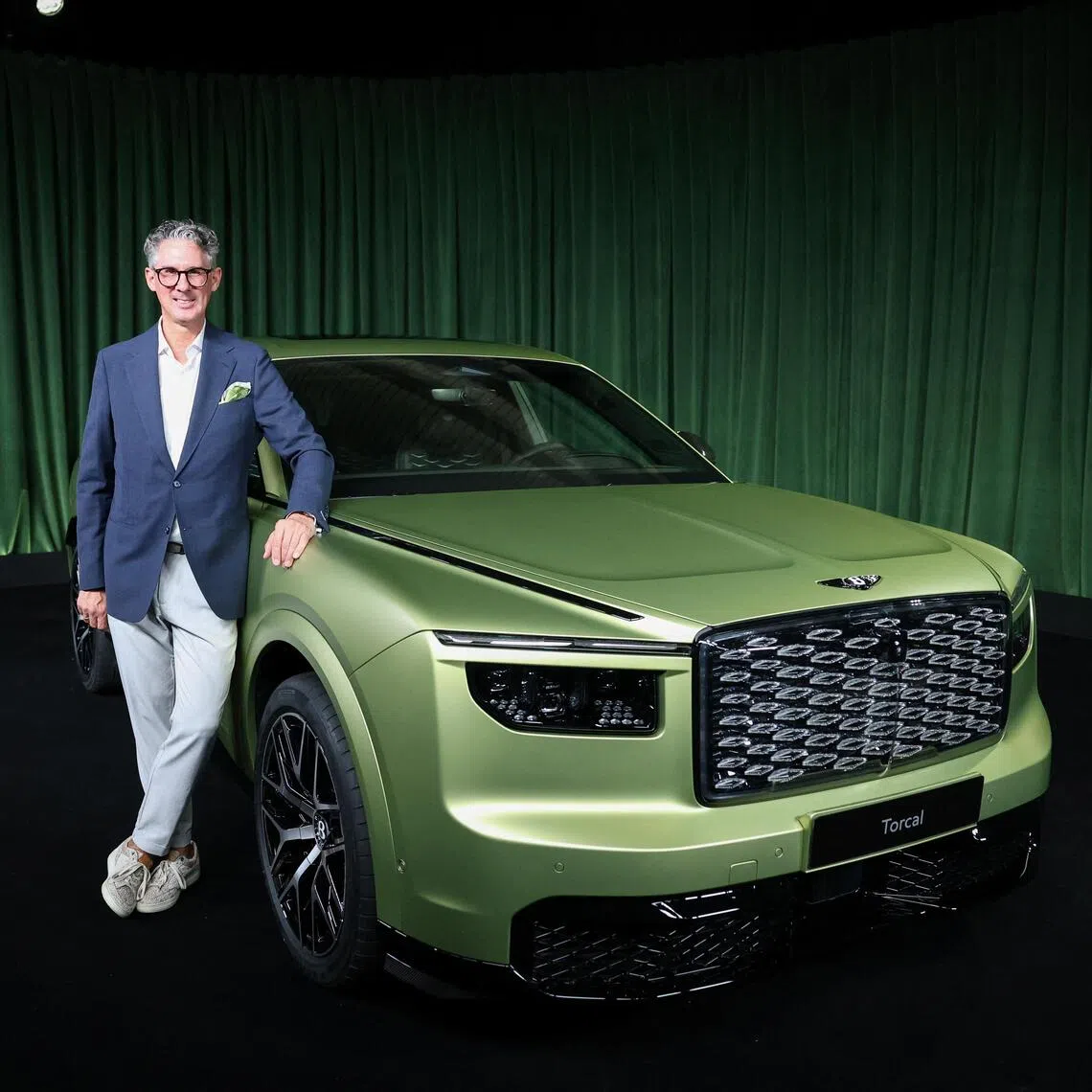 Chairman and CEO of Bentley Motors, Frank-Steffen Walliser, posing beside the Torcal, Bentley’s first fully-electric model, during a launch event in London, Britain, on Sept 23.