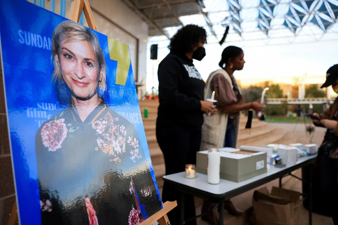 Rust cinematographer Halyna Hutchins is pictured (left) at a vigil in her honour. 