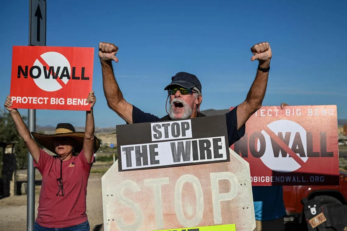 People protesting the plans by US President Donald Trump’s administration to build a section of the border wall at the Big Bend National Park in Study Butte, Texas, on Aug 15.