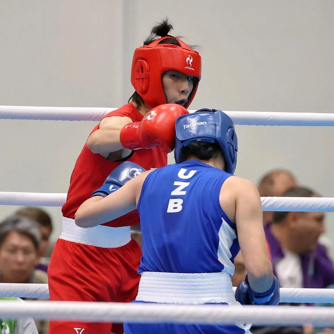 Lin Yu-ting (left) of Chinese Taipei in action against Sitora Turdibekova of Uzbekistan during the Asian Games boxing women’s 60kg semi-final at Nishio Gymnasium on Sept 30.
