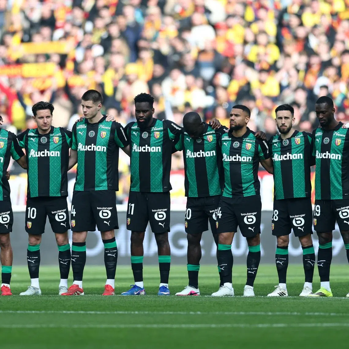 FILE PHOTO: Soccer Football - Ligue 1 - RC Lens v FC Metz - Stade Bollaert-Delelis, Lens, France - March 8, 2026 RC Lens players line up before the match. REUTERS/Stephane Mahe/File Photo