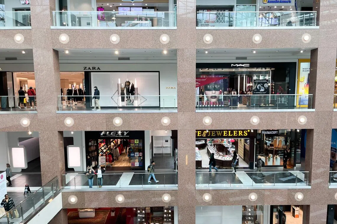 (FILES) Shoppers walk through the Fashion Centre at Pentagon City, a shopping mall in Arlington, Virginia, February 2, 2024. US economic growth blew past expectations in the second quarter, boosted by consumer spending and inventory building despite high interest rates, government data showed on July 25, 2024, after a slow start to the year. The world's biggest economy grew 2.8 percent in the April to June period, up from 1.4 percent in the first three months this year, said the Commerce Department. (Photo by SAUL LOEB / AFP)