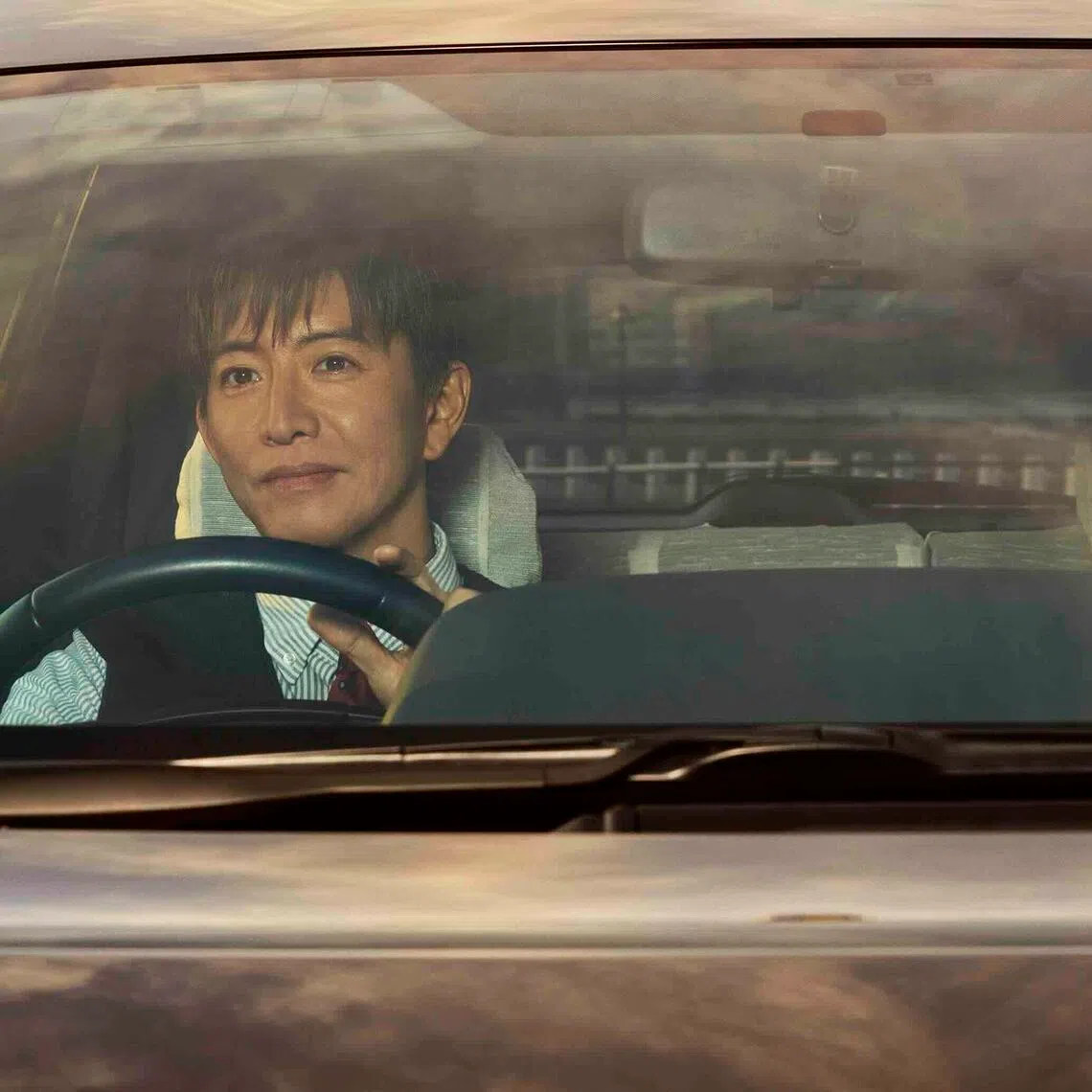 From left: Takuya Kimura and Chieko Baisho in Tokyo Taxi.