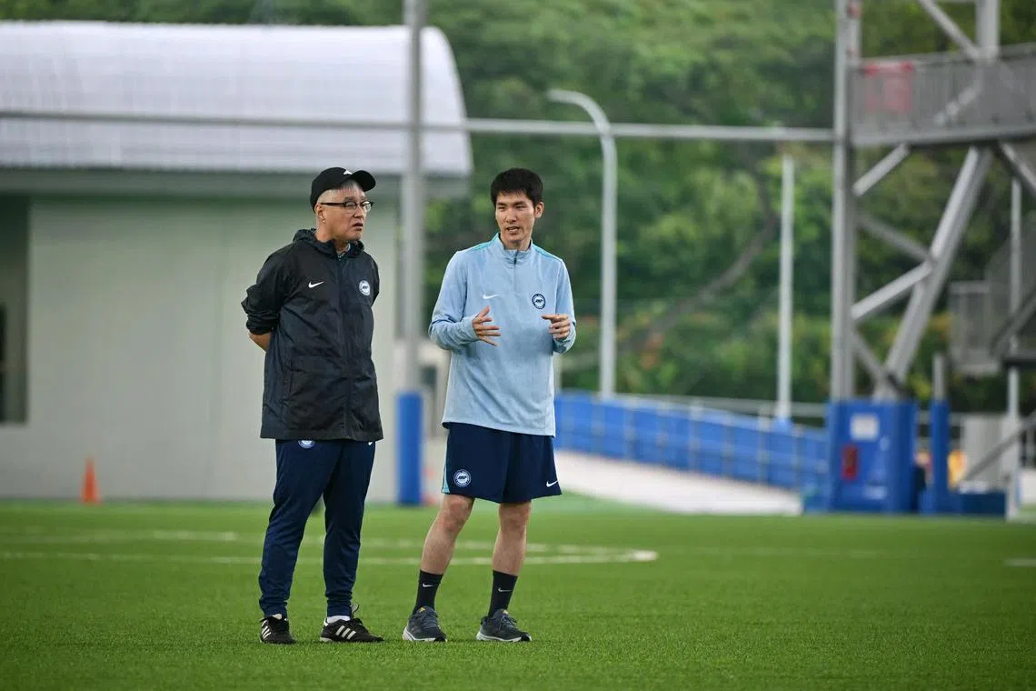 National coach Tsutomu Ogura and head analyst Satoru Okada during the Lions' training session at Kallang Football Hub on March 19.