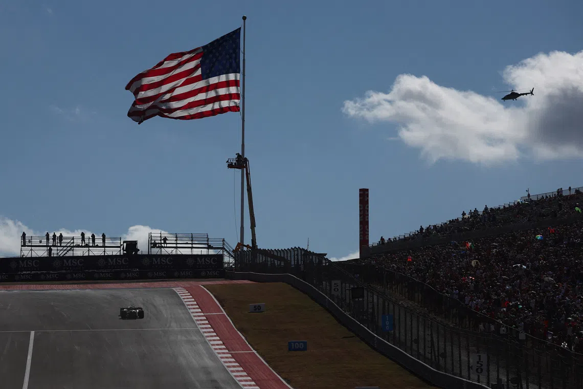 Formula One F1 - United States Grand Prix - Circuit of the Americas, Austin, Texas, U.S. - October 18, 2025 General view of a giant America flag above the track before sprint qualifying REUTERS/Jakub Porzycki