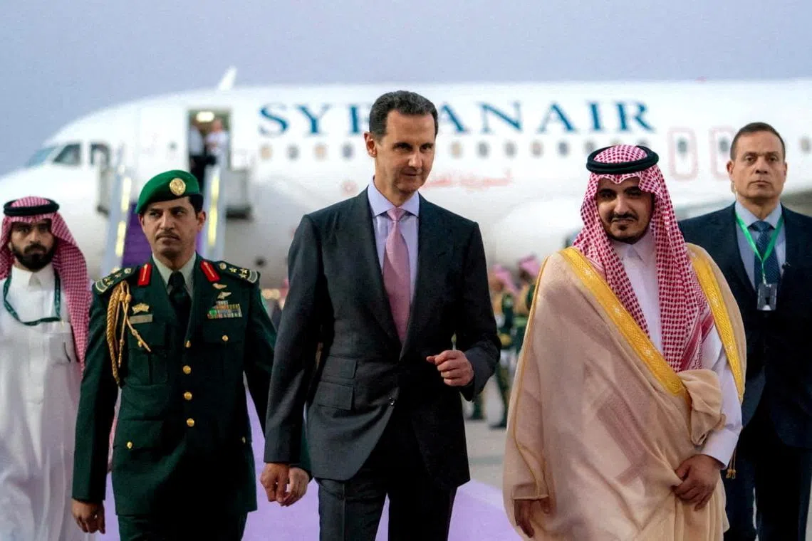 Syria's President Bashar al-Assad (centre) arrives in Jeddah, on May 18, 2023. 
