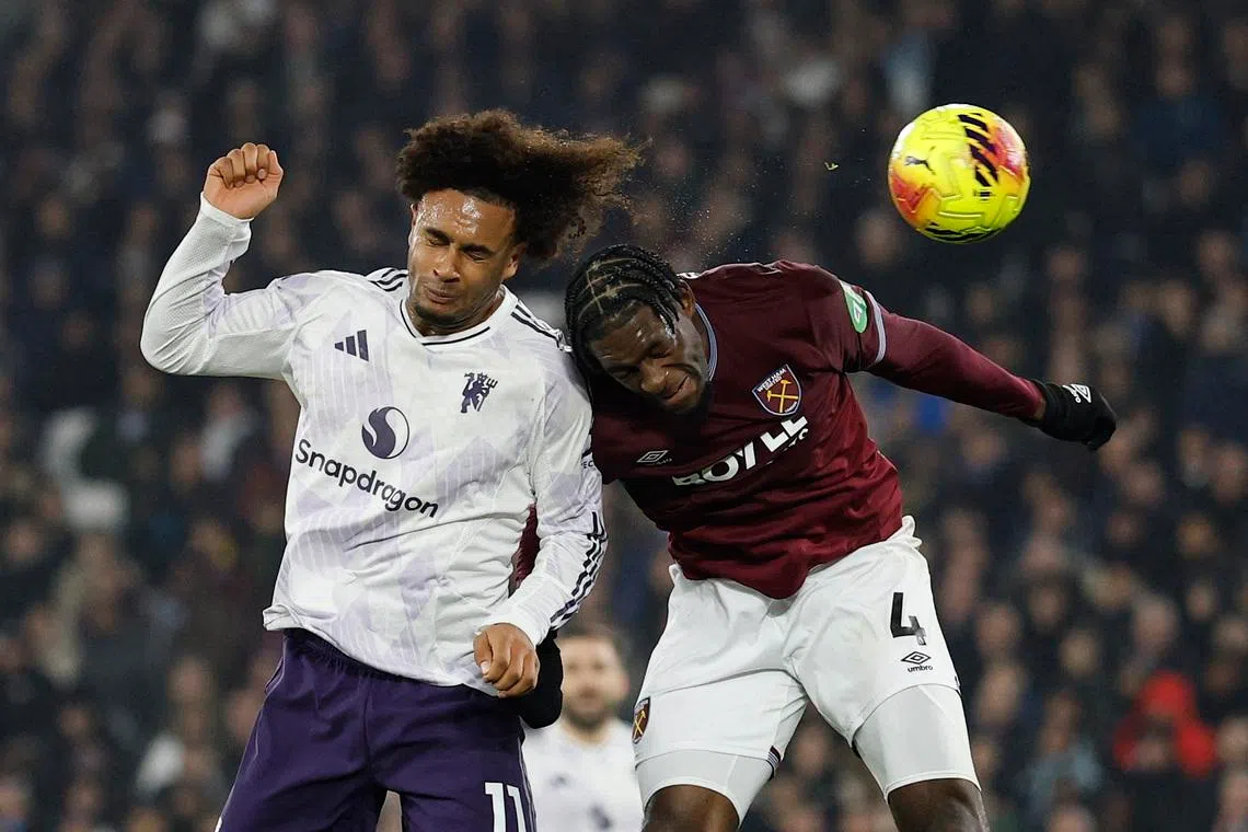 Soccer Football - Premier League - West Ham United v Manchester United - London Stadium, London, Britain - February 10, 2026 Manchester United's Joshua Zirkzee heads wide as West Ham United's Axel Disasi challenges Action Images via Reuters/Peter Cziborra