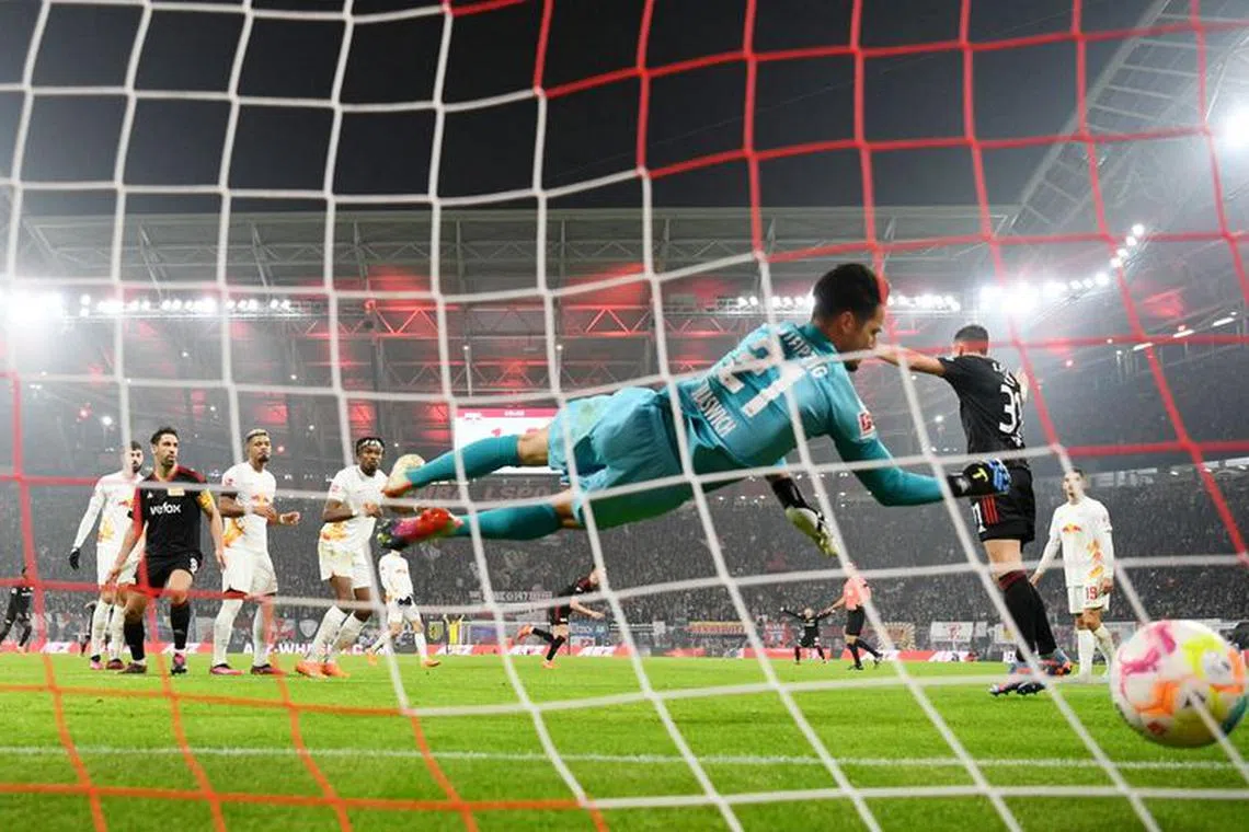 FILE PHOTO: Soccer Football - Bundesliga - RB Leipzig v Union Berlin - Red Bull Arena, Leipzig, Germany - February 11, 2023 1. FC Union Berlin's Janik Haberer scores their first goal pass RB Leipzig's Janis Blaswich REUTERS/Annegret Hilse/File Photo