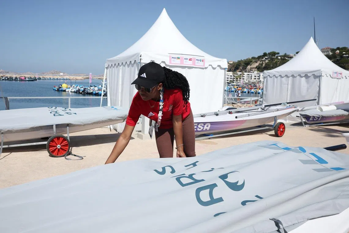 Paris 2024 Olympics - Sailing Training - Marseille Marina, Marseille, France - July 28, 2024. Deizy Nhaquile of Mozambique prepares a sail before training. REUTERS/Andrew Boyers
