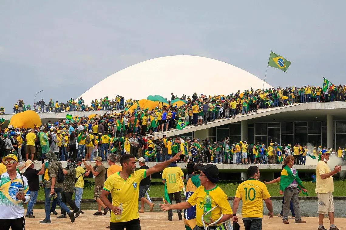 Hundreds of supporters of former Brazilian President Jair Bolsonaro invaded the headquarters of the National Congress on Jan 8.